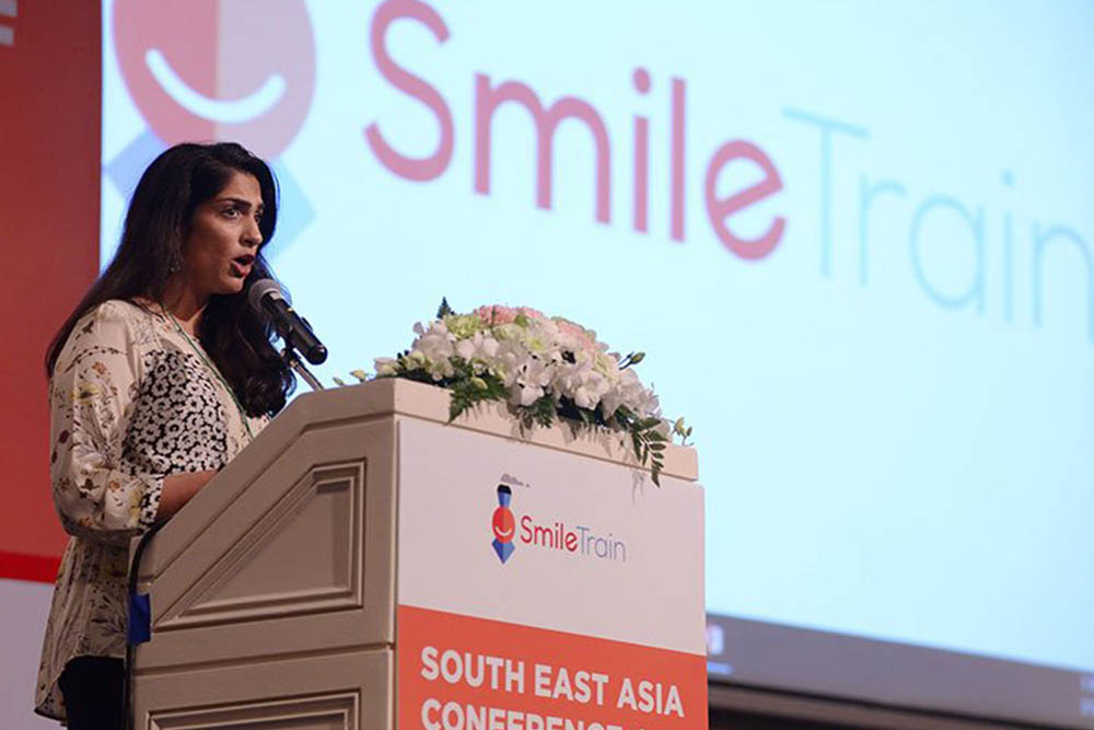 Priya presenting at a conference