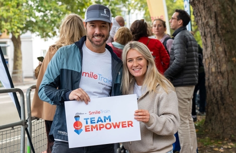 Candace Mauck and Troy Reinhart smiling at a Team Empower event